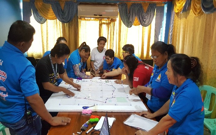 QGIS Re-Echo Workshop held last July 7, 2017. Brgy staff and volunteer are working on the identiication of the critical infrstuctures in their Brgy prior plotting it in the application. Photo by Philippine Red Cross.