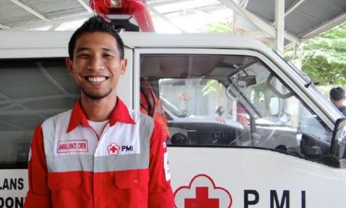 June 3, 2014. Banda Aceh, Indonesia. When hes not studying at university, Nur Hadi spends his time as a volunteer EMT for the Indonesian Red Cross. Determined to help his town stay safe during emergencies, he and other university students provide medical care during natural disasters, at the local soccer games, and for any other emergencies that happen in their town. The American Red Cross has funded EMT training for the volunteers and helped their local Red Cross branchwhich was severely impacted by the 2004 Indian Ocean Tsunamito develop its programs over the past ten years. Helping local Red Cross branches to be strong and self-sustaining is a vital piece of the American Red Crosss disaster preparedness work  ensuring that volunteers and first responders are ready to act in times of crisis. Photo by Jenelle Eli/American Red Cross