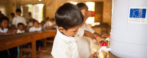 Students distribute clean filtered water from the dispensers in the Samproach Primary School in Krasaing Chrum Tbaung, Samproach Commune, Stoung District, Kampong Thom Province. The province was one of the worst-affected areas during the floods of 2011, affecting close to 2 million people. Following the emergency relief operation, ECHO provided support for a project improving food security and resilience to climatic hazards. Kampong Thom 29/01/13 Olivier Matthys