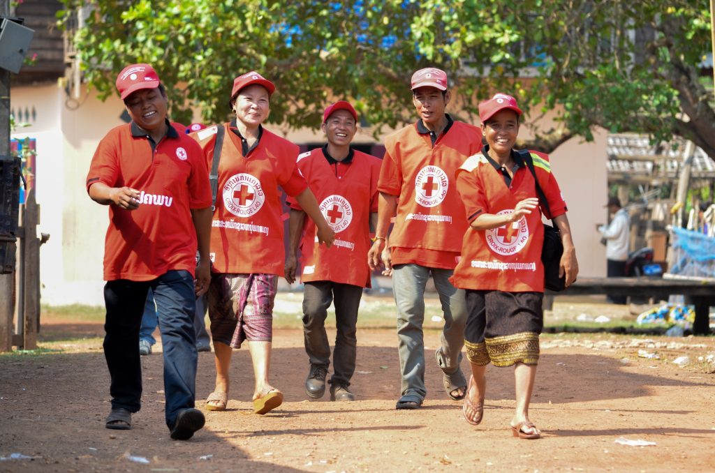 Khammouane Province, Laos, 2015 There is no I in teamwork. Village Disaster Protection Unit members share a laugh together following completion of a Community Based Disaster Risk Reduction simulation. The exercises and drills focus on disaster preparedness and response at village level, ensuring communities are equipped with skills to activate emergency plans and save lives. Through the simulation project Lao Red Cross and partner French Red Cross, with support from the European Union, are improving safety for vulnerable communities.